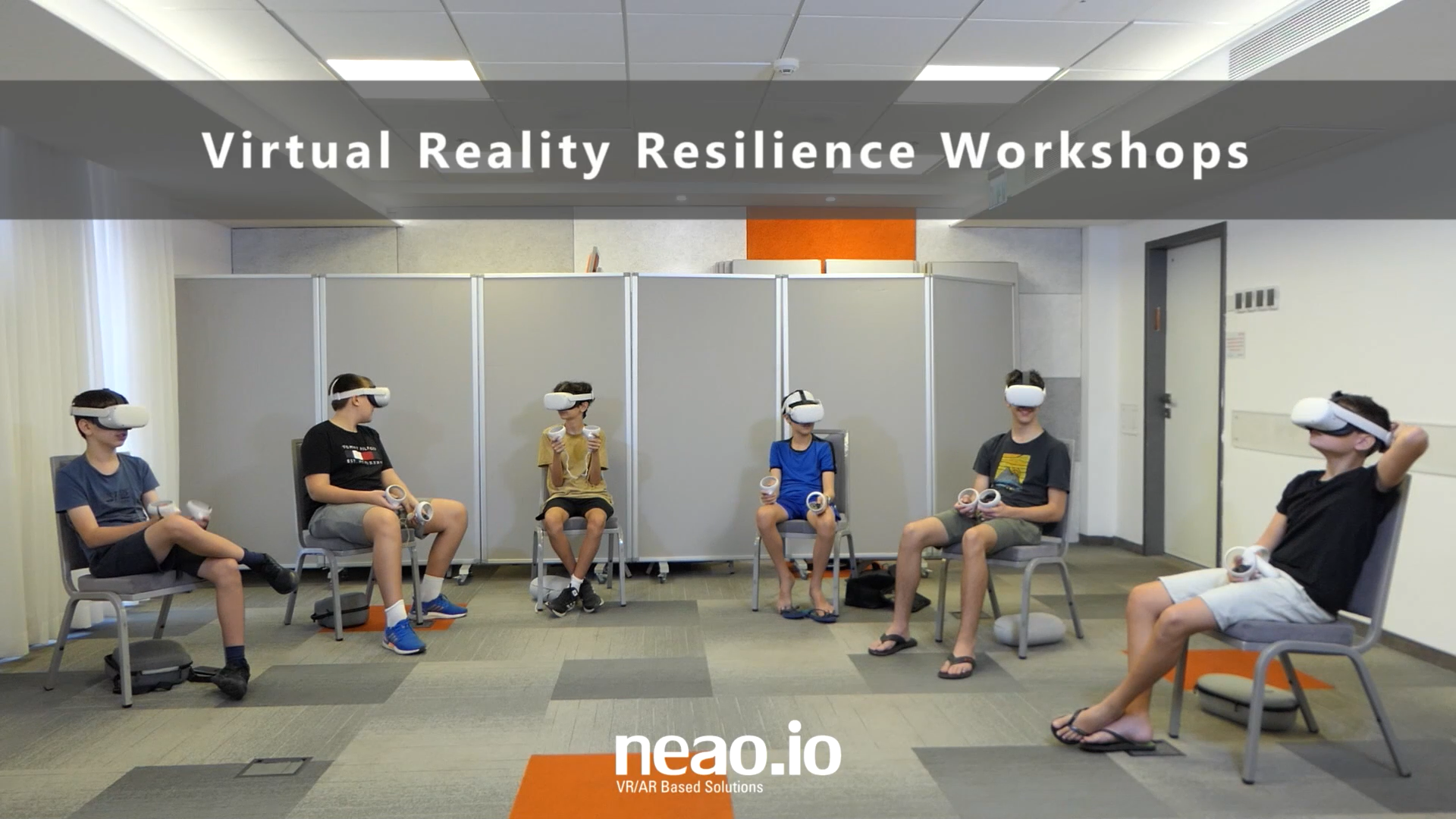 An image of teenagers sitting in a circle with VR devices during a resilience workshop